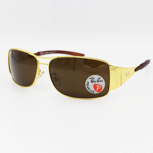 عکس از عینک آفتابی با لنز قهوه‌ای، شیشه‌ای و پلاریزه و فریم طلایی خلبانی برند ری بن مدل 3320