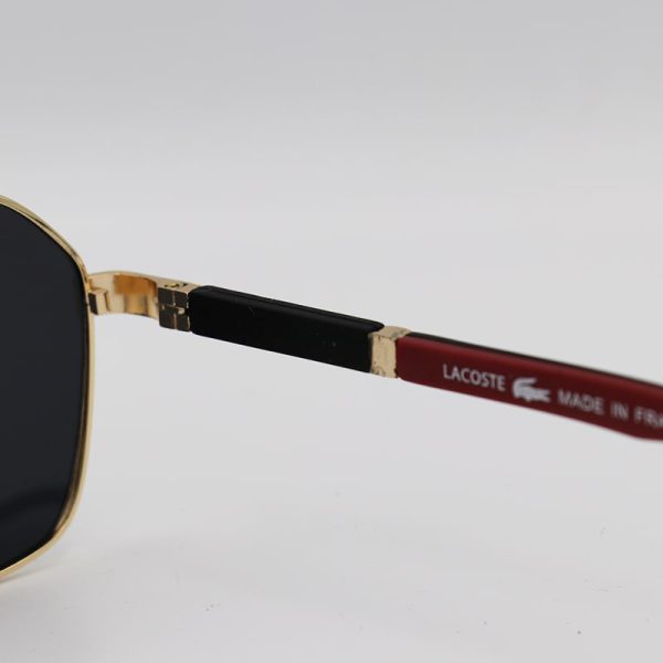 عکس از عینک آفتابی خلبانی لاگوست با فریم طلایی رنگ و دسته فنری و لنز پلاریزه مدل l125