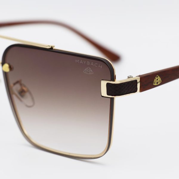 عکس از عینک آفتابی میباخ با فریم طلایی، مربعی، دسته طرح چوب و لنز قهوه ای مدل 22058
