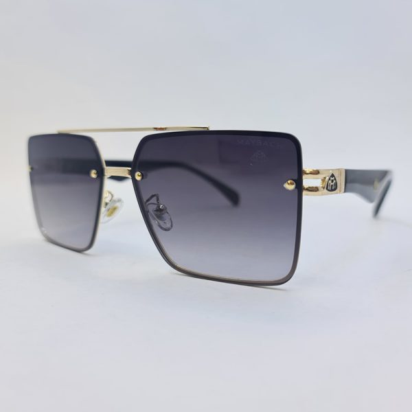 عکس از عینک دودی میباخ با فریم طلایی، لنز هایلایت و دسته مشکی مدل 10402