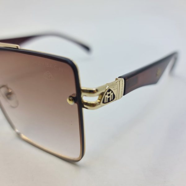 عکس از عینک آفتابی میباخ با فریم طلایی، لنز قهوه ای و دسته قهوه ای مدل 10402