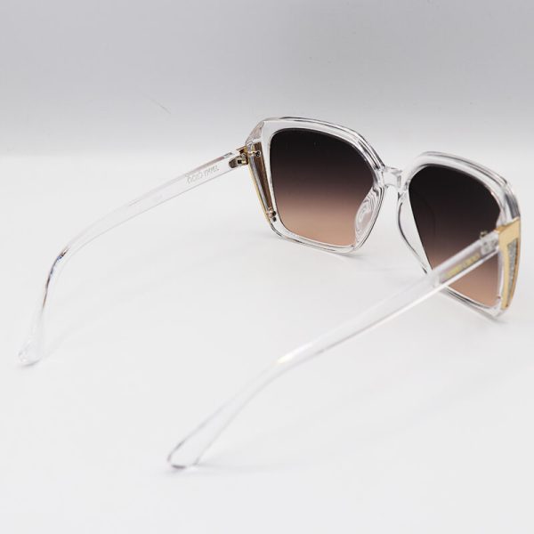 عکس از عینک آفتابی زنانه با فریم بی‌رنگ و شفاف، شاین‌دار و لنز قهوه‌ای جیمی چو مدل 7204