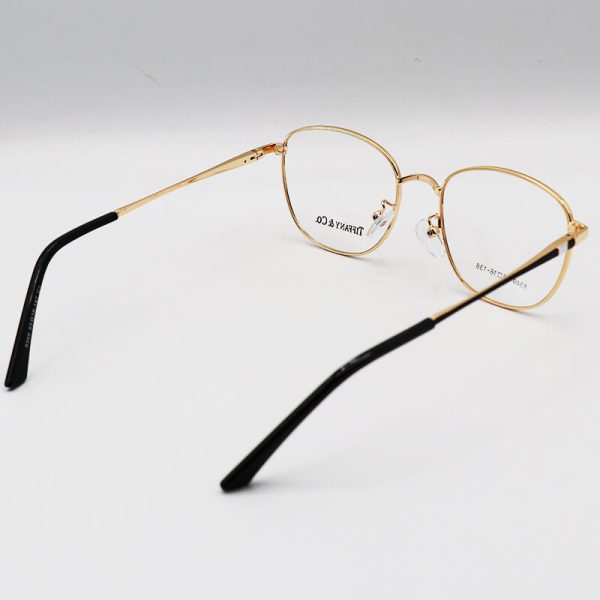 عکس از عینک طبی گرد با فریم فلزی، طلایی و سیاه رنگ برند تیفانی مدل 8349
