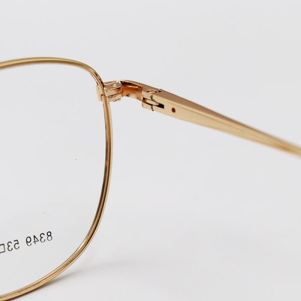 عکس از عینک طبی گرد با فریم فلزی، طلایی و سیاه رنگ برند تیفانی مدل 8349