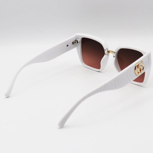 عکس از عینک آفتابی زنانه با فریم کائوچو، سفید و لنز قهوه ای رنگ برند gucci مدل 8847