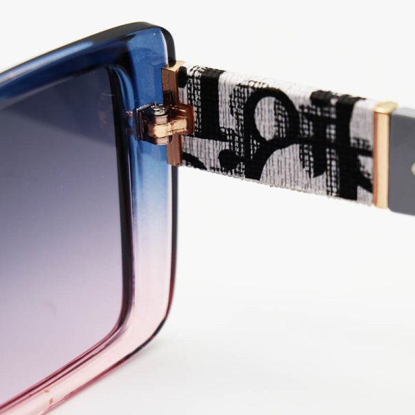 عکس از عینک آفتابی دیور، با فریم مستطیلی، دو رنگ و دسته طوسی و لنز تیره مدل 8945