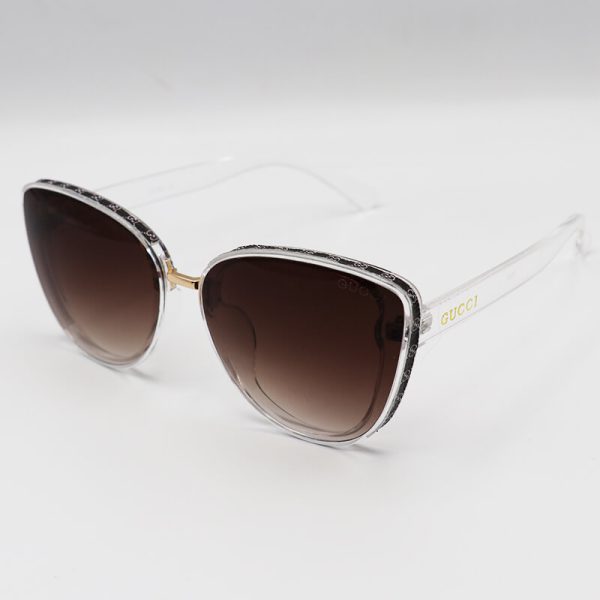 عکس از عینک آفتابی زنانه gucci با فریم شفاف و بی رنگ، گربه ای و لنز قهوه ای مدل 7257