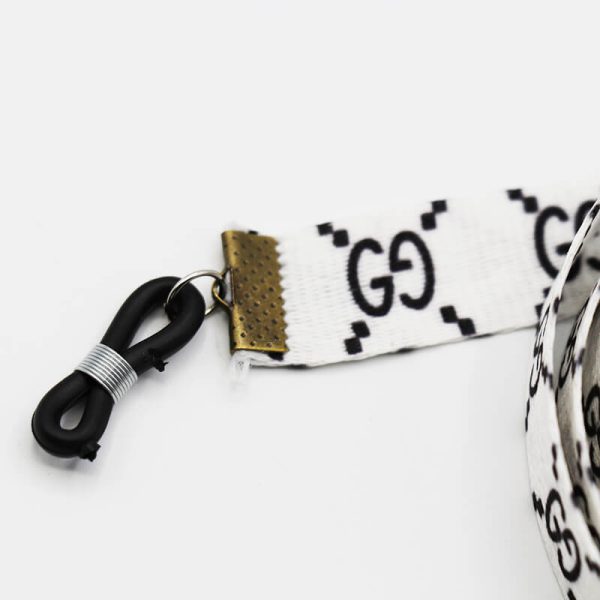 عکس از بند عینک نواری گوچی gucci با رنگ سفید و از جنس پارچه‌ای مدل 992543
