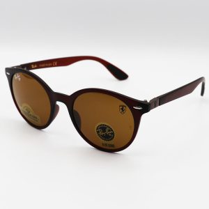 عکس از عینک آفتابی Ray-Ban Ferrari با فریم گرد، قهوه ای مات، لنز جنس سنگ مدل RB716
