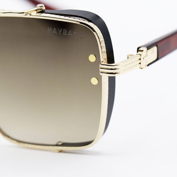 عکس از عینک آفتابی میباخ با فریم رنگ طلایی، چندضلعی شکل و عدسی قهوه ای سایه روشن مدل 251