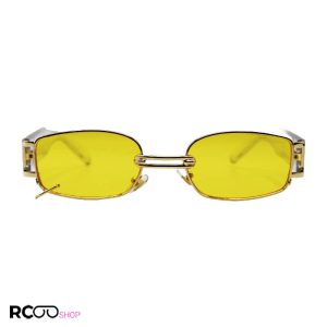 عکس از عینک شب پیرسینگ دار، با فریم مستطیلی شکل، طلایی رنگ و دسته شفاف جنتل مانستر مدل 8032