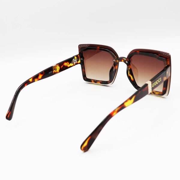 عکس از عینک آفتابی gucci زنانه با فریم هاوانا، مربعی شکل و لنز قهوه ای سایه روشن مدل 6834