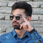 عکس از عینک آفتابی امریکن اپتیکال AO با فریم فلزی، خلبانی کلاسیک و عدسی شیشه ای و سنگ مدل AO54 بر روی صورت محمدحسین ابراهیم زاده