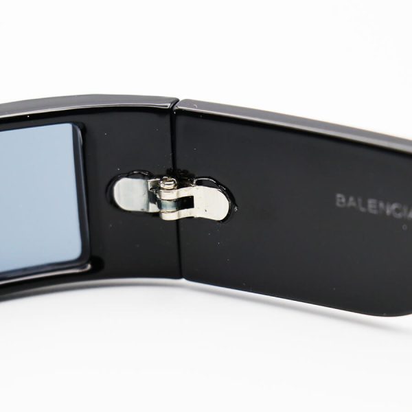 عکس از عینک آفتابی فانتزی طرح تل با فریم مشکی رنگ، باریک و عدسی دودی تیره balenciaga مدل w68176
