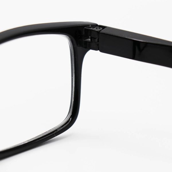 عکس از عینک مطالعه نزدیک بین با عدسی سنگ و شیشه ای، فریم مشکی رنگ، مستطیلی و دسته فنردار مدل 711