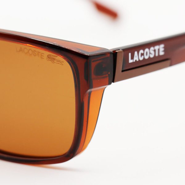 عکس از عینک آفتابی پلاریزه لاگوست با فریم مستطیلی شکل، قهوه ای براق و لنز قهوه‌ای تیره مدل 21065