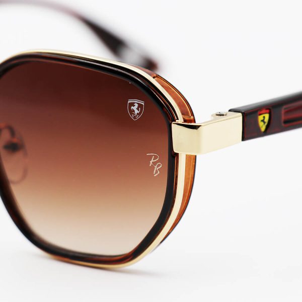 عکس از عینک آفتابی ray-ban و ferrari با فریم طلایی و قهوه ای رنگ و لنز سایه روشن مدل 3674
