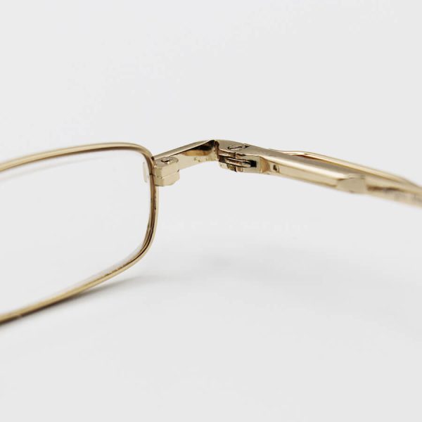 عکس از عینک مطالعه خودکاری با فریم طلایی، دسته فنری، لنز شیشه ای و قاب طلایی مدل ca1035