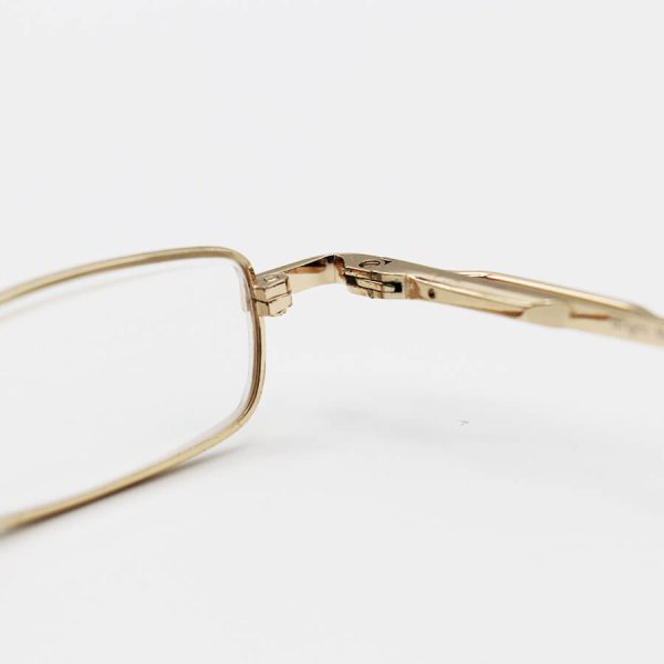 عکس از عینک مطالعه خودکاری نزدیک بین با فریم طلایی، دسته فنری، لنز شیشه ای و قاب زیتونی مدل ca1035