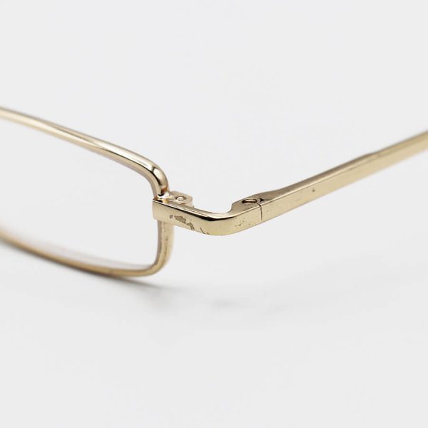 عکس از عینک مطالعه خودکاری نزدیک بین با فریم طلایی، دسته فنری، لنز شیشه ای و قاب زیتونی مدل ca1035