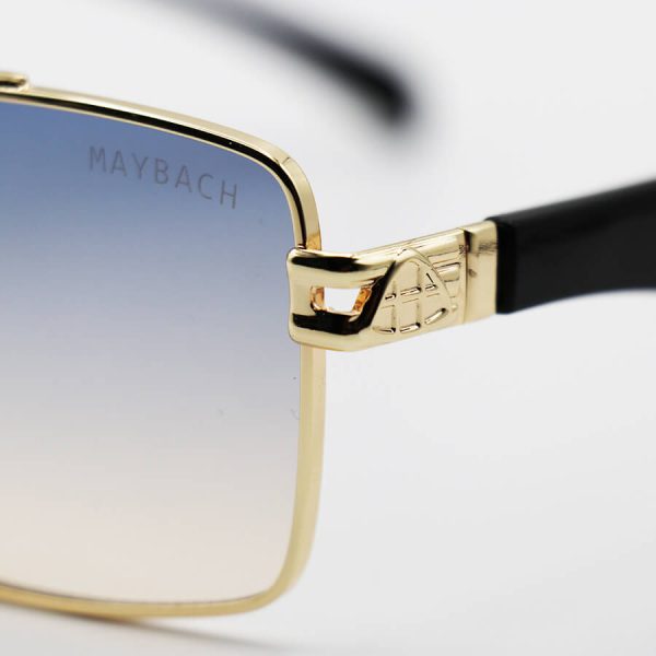 عکس از عینک آفتابی مستطیلی شکل با فریم طلایی رنگ و عدسی دو رنگ سایه روشن می‌باخ مدل 2324