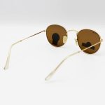 عکس از عینک آفتابی گرد RAY-BAN با فریم فلزی، طلایی رنگ، عدسی سنگ و قهوه ای تیره مدل 3447