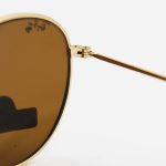 عکس از عینک آفتابی گرد RAY-BAN با فریم فلزی، طلایی رنگ، عدسی سنگ و قهوه ای تیره مدل 3447