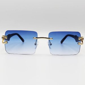عکس از عینک آفتابی فریم لس Cartier با عدسی آبی سایه روشن، دسته چوبی و طرح یوزپلنگ مدل 7288