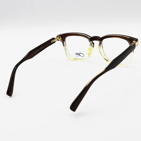 عکس از عینک طبی با فریم قهوه ای و سبز رنگ، مربعی شکل، از جنس کائوچو و لولا فلزی cazal مدل jh139