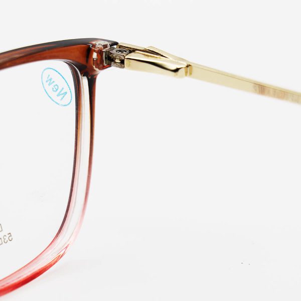 عکس از عینک طبی مستطیلی شکل با فریم دو رنگ، دسته طلایی و فنری swarovski مدل dt1827