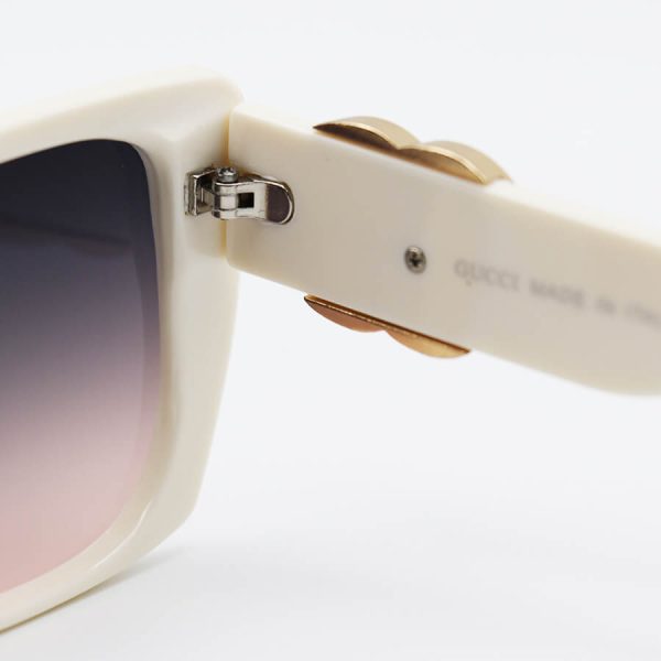 عکس از عینک آفتابی gucci با فریم کرمی رنگ، پروانه ای شکل و عدسی قهوه ای تیره مدل m9055