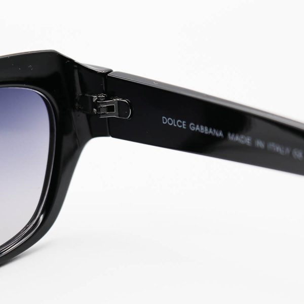 عکس از عینک آفتابی دولچه گابانا با فریم مشکی رنگ، بیضی شکل و عدسی دودی سایه روشن مدل 6087
