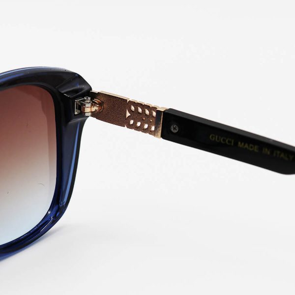 عکس از عینک آفتابی زنانه gucci با فریم سرمه ای رنگ، گربه ای شکل و لنز قهوه ای هایلایت مدل m9060