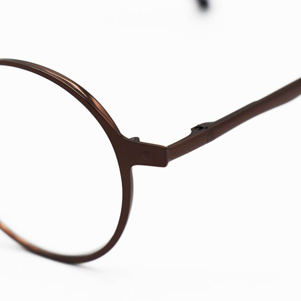 عکس از عینک مطالعه نزدیک بین با فریم گرد، رنگ مسی و دسته فنری مدل 1021