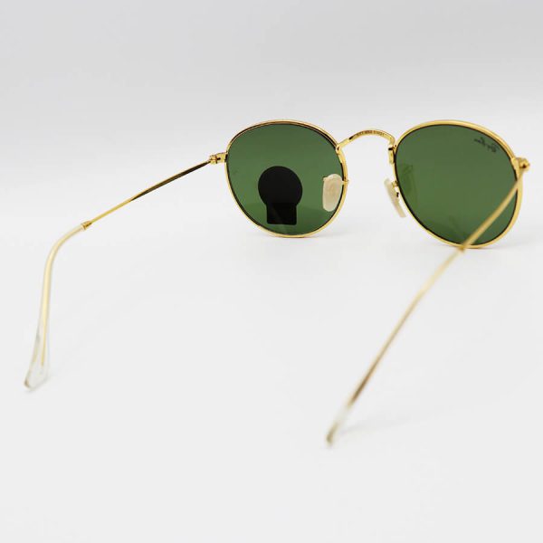 عکس از عینک آفتابی ری بن با فریم گرد، طلایی رنگ، عدسی شیشه ای و رنگ سبز تیره مدل 3447