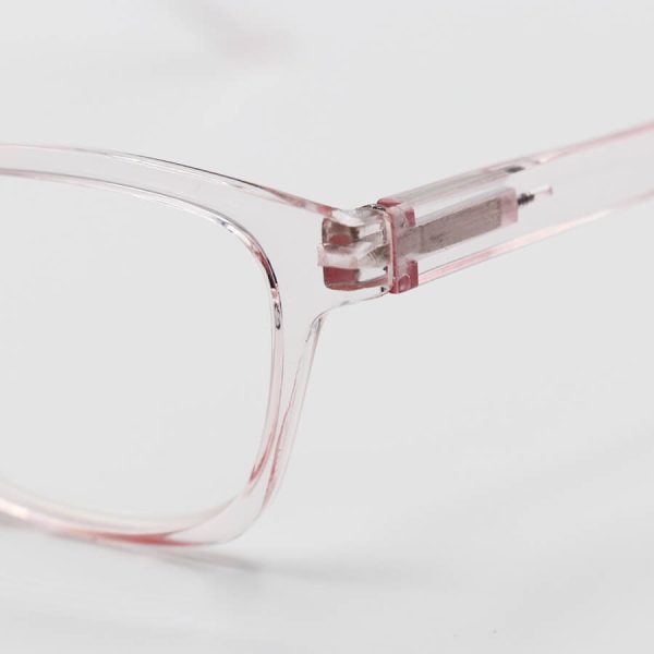 عکس از عینک مطالعه نزدیک بین با فریم صورتی رنگ، مستطیلی شکل و دسته فنری مدل 8987