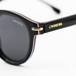 عکس از عینک آفتابی پلاریزه Carrera با فریم گرد، مشکی رنگ، لنز دودی تیره و دسته سیم دار مدل P581006