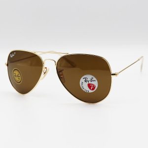 عکس از عینک آفتابی خلبانی Ray-Ban با فریم طلایی، لنز سنگ، قهوه ای رنگ، آنتی رفلکس و پلاریزه مدل 3026-S62