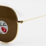 عکس از عینک آفتابی خلبانی Ray-Ban با فریم طلایی، لنز سنگ، قهوه ای رنگ، آنتی رفلکس و پلاریزه مدل 3026-S62