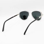 عکس از عینک آفتابی خلبانی Ray-Ban با فریم نقره ای رنگ، دسته فنری و لنز شیشه ای و دودی تیره مدل RB3115-1