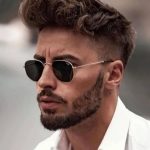 عکس از عینک آفتابی ریبن با فریم هندیسی و چندضلعی و لنز سنگ چندضلعی مدل 3548 بر روی صورت
