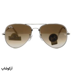 عکس از عینک آفتابی Ray-Ban با فریم خلبانی، رنگ نقره‌ای، لنز سنگ و قهوه‌ای سایه روشن مدل RB3026