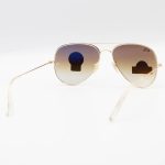 عکس از عینک آفتابی Ray-Ban با فریم خلبانی، رنگ طلایی، لنز سنگ و قهوهای سایه روشن مدل RB3026