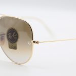 عکس از عینک آفتابی Ray-Ban با فریم خلبانی، رنگ طلایی، لنز سنگ و قهوهای سایه روشن مدل RB3026