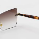 عکس از عینک آفتابی زنانه Moscot فریملس، لنز قهوه‌ای سایه روشن، طرح گربه‌ای و دسته قهوه‌ای مدل M6244