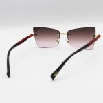 عکس از عینک آفتابی زنانه Moscot فریملس، لنز قهوهای هایلایت، طرح گربهای و دسته مشکی و قرمز مدل M6244