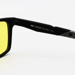 عکس از عینک دید در شب پلاریزه Ray-Ban با فریم رنگ مشکی مات، شکل مستطیلی و لنز زرد رنگ مدل PL003