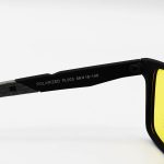 عکس از عینک دید در شب پلاریزه Ray-Ban با فریم رنگ مشکی مات، شکل مستطیلی و لنز زرد رنگ مدل PL003