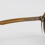 عکس از عینک آفتابی پلاریزه Moscot با فریم گرد، رنگ قهوهای، دسته سیمدار و لنز قهوهای هایلایت مدل P1206
