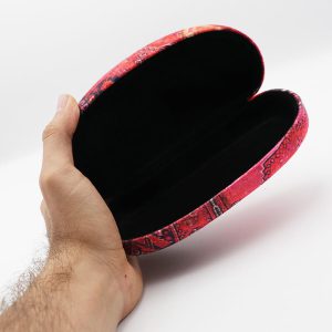 عکس از قاب عینک طرح هارد کیس، از جنس مخملی، بیضی شکل، چند رنگ و درب لولا فنری مدل 992875